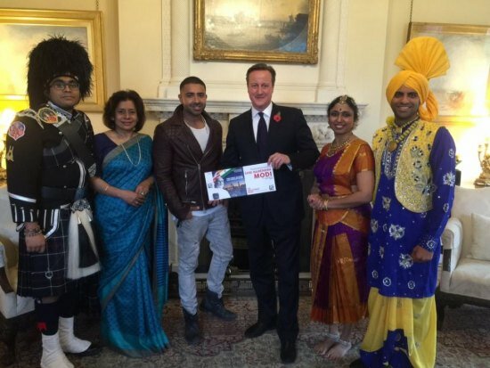 Narendra Modi UK visit 2015: Pics of electric atmosphere at Wembley Stadium for 'UKWelcomesModi' community reception UK Indian artists invite Uk PM David Cameron to the UKWelcomesModi Community Reception